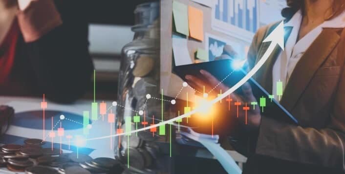 overlay of forex trading price action in front of buisness ppl