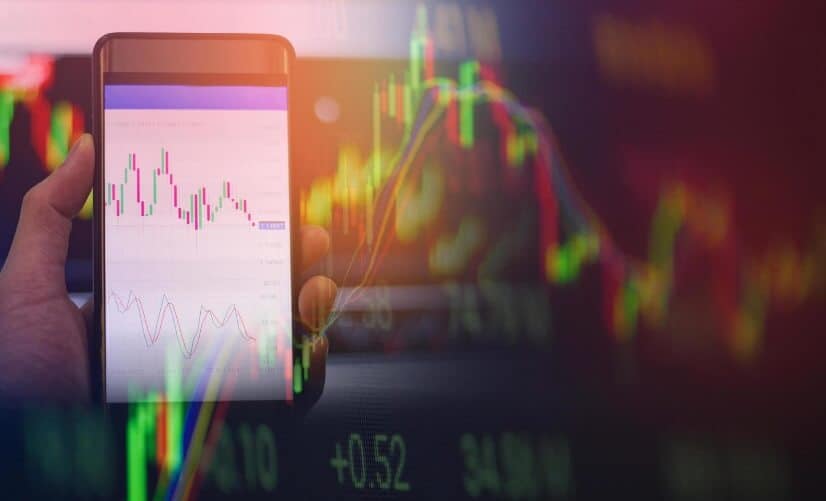 overlay of forex chart with phone showing trading chart