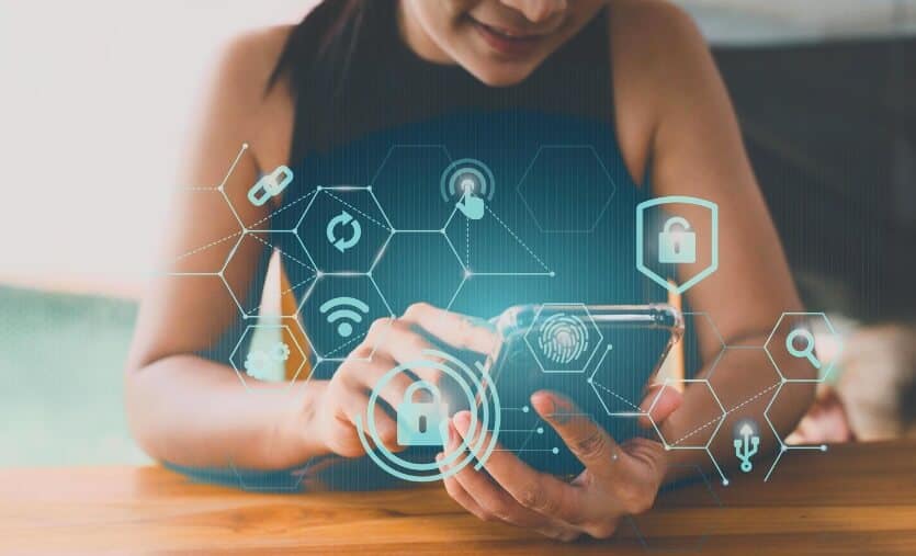 woman with phone showing virtual trading data